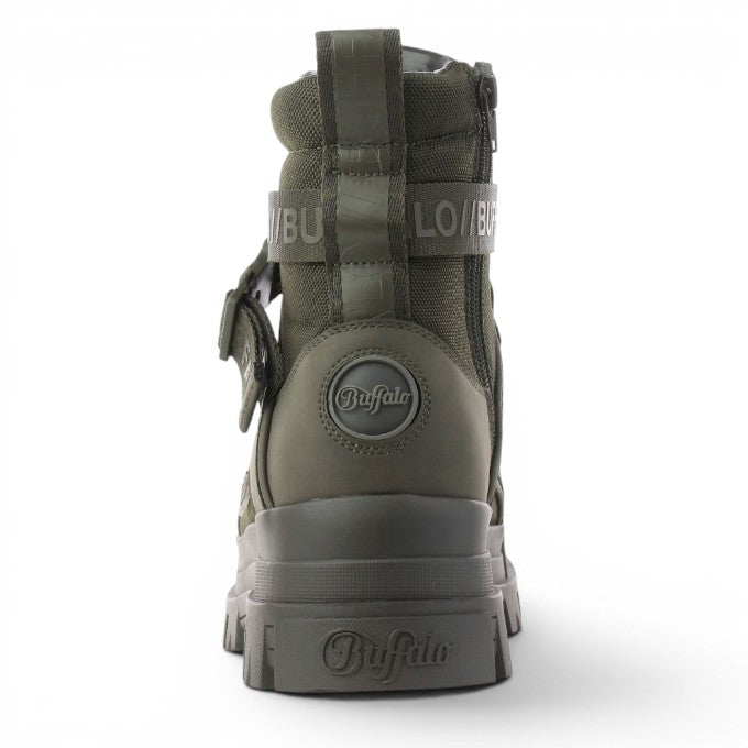 Buffalo Aspha Com1 BS olive green combat boots with buckle strap and side zip. Chunky platform sole.