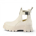 Buffalo cream leather ankle boots with cut-out sides and adjustable strap with buckle closure.
