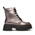 Buffalo Aspen Lace Up Mid boots in metallic rose gold with a chunky black sole and black laces.