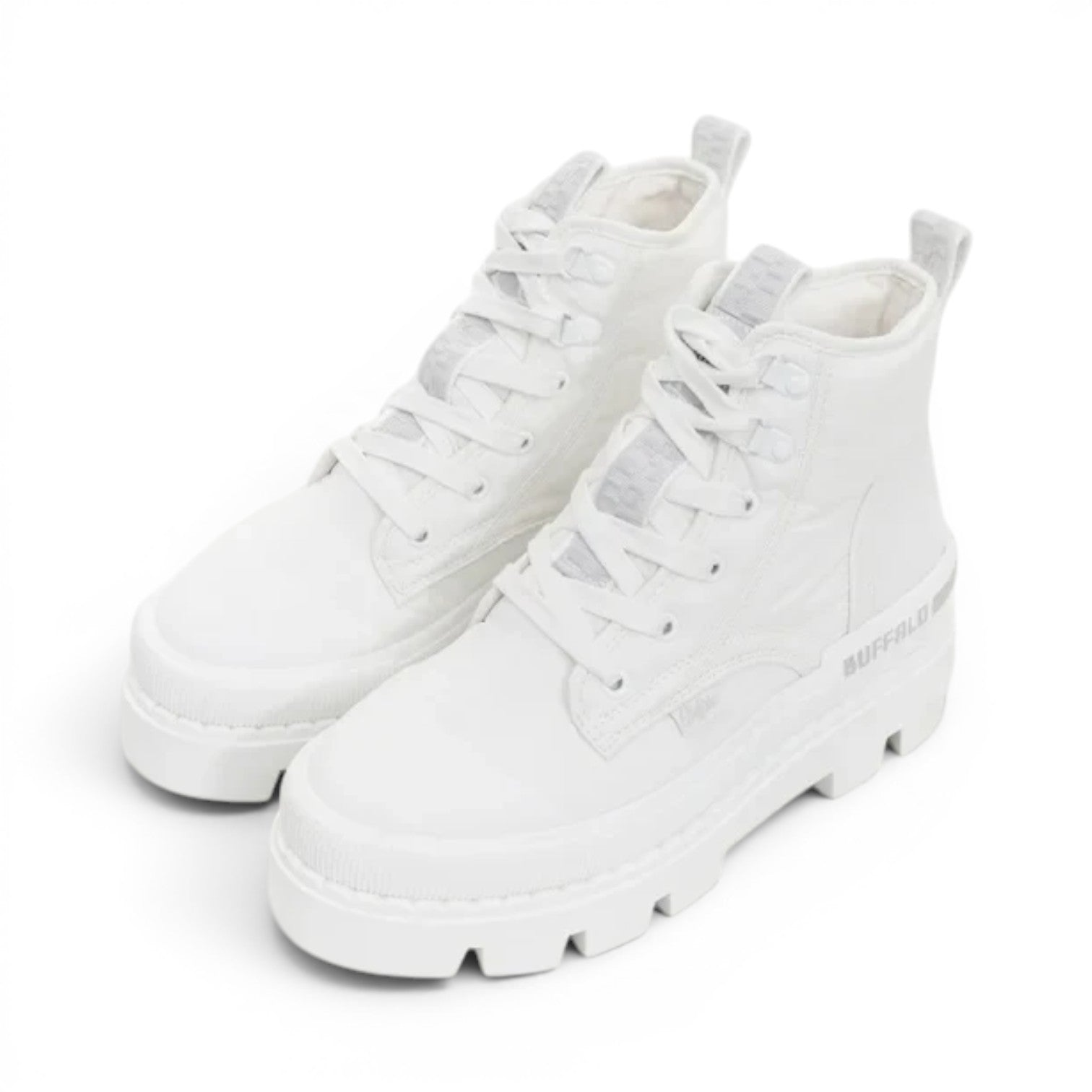 Buffalo Raven Hi white canvas lace-up platform boots with a chunky sole and pull tabs.
