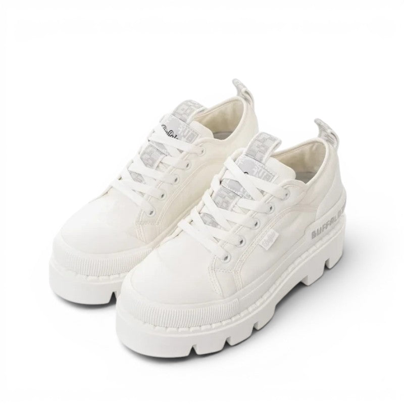 Buffalo white canvas platform sneakers with chunky sole and logo detail on tongue and side.