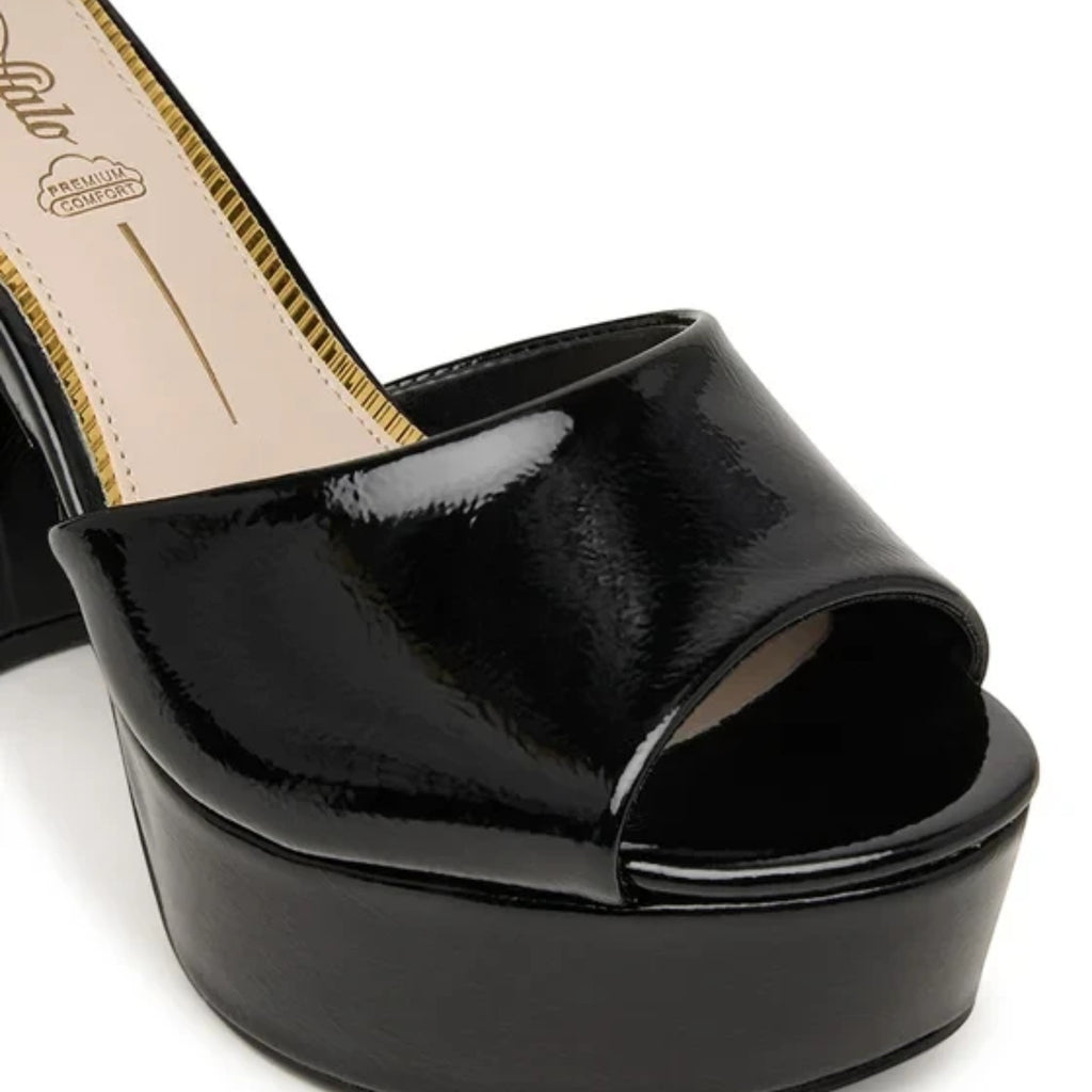 Buffalo Jessie Neat black patent platform sandals with peep toe and ankle strap.