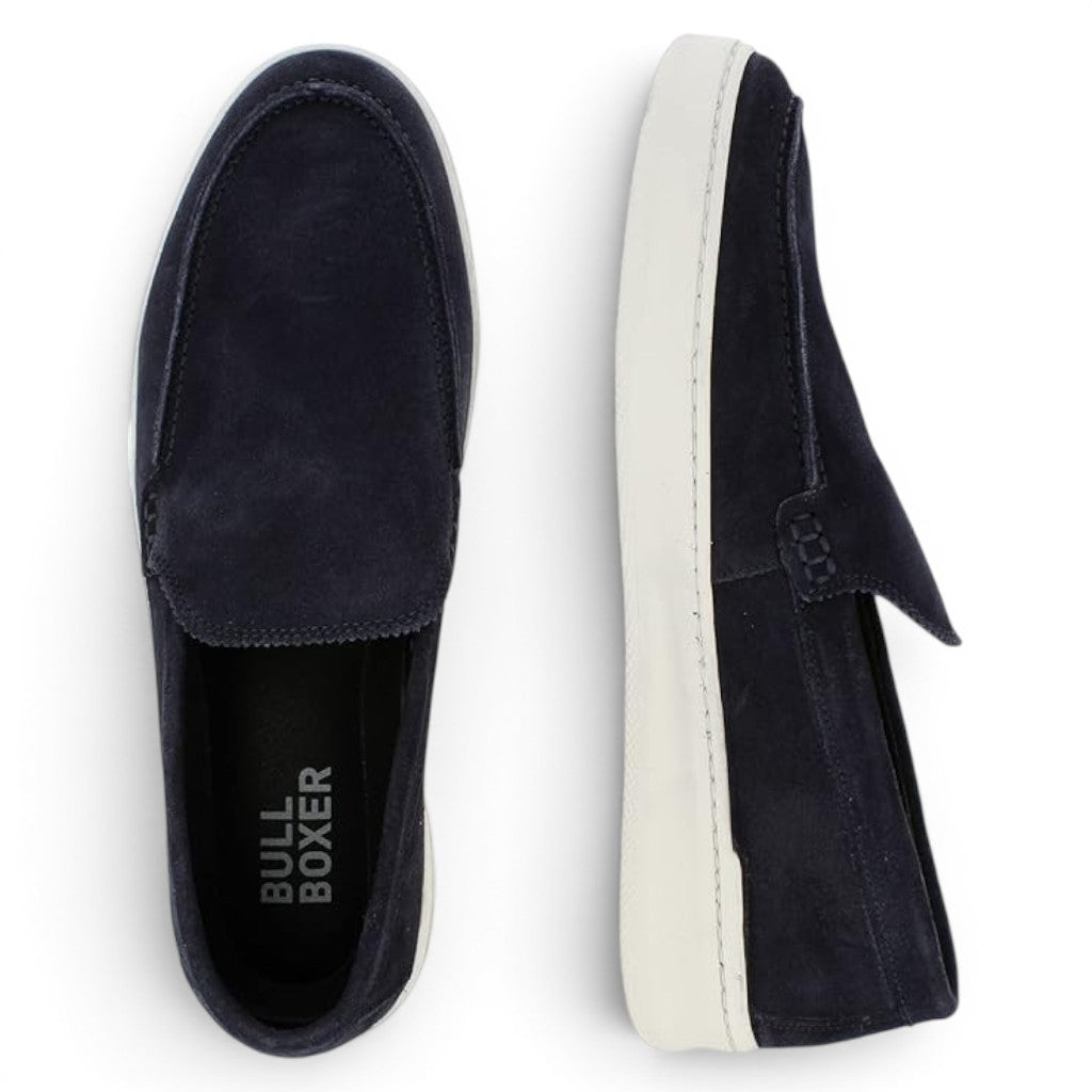 Bullboxer navy blue suede slip-on loafers with white soles and decorative stitching.