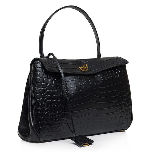 ShoeShop Rodeo black leather handbag with crocodile embossed texture, gold turn-lock closure, and detachable strap.