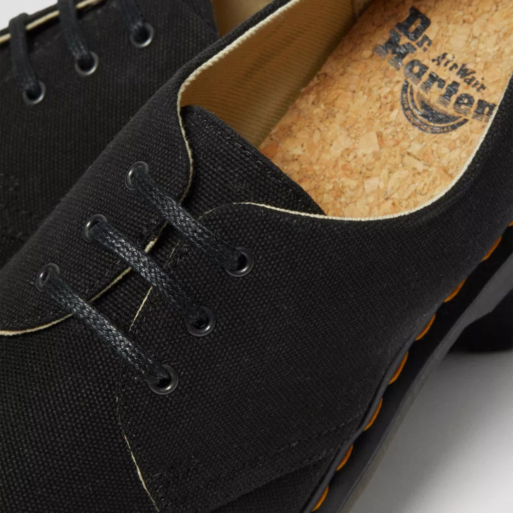 My Store black canvas oxford shoes with cork insoles and yellow stitching detail.