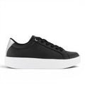 My Store black faux leather low-top sneakers with white sole and silver heel accent. Champion logo embossed on side.