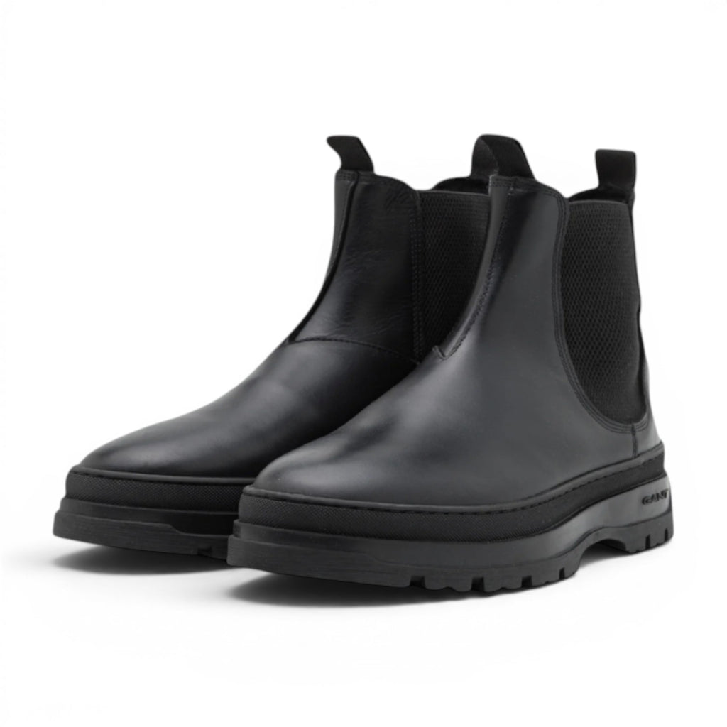 My Store black leather Chelsea boots with elasticated side panels and a chunky lug sole. GANT logo on sole.