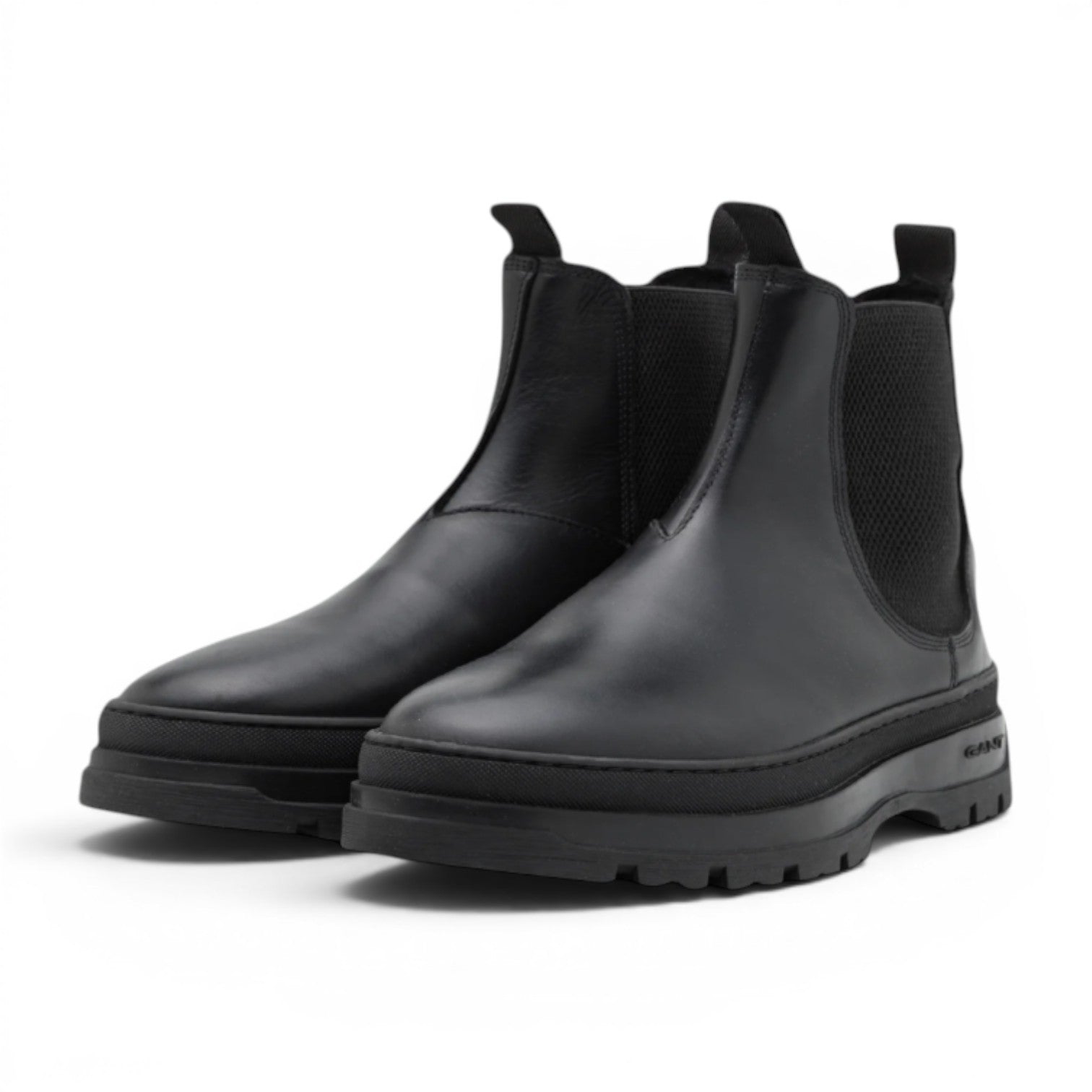 My Store black leather Chelsea boots with elasticated side panels and a chunky lug sole. GANT logo on sole.