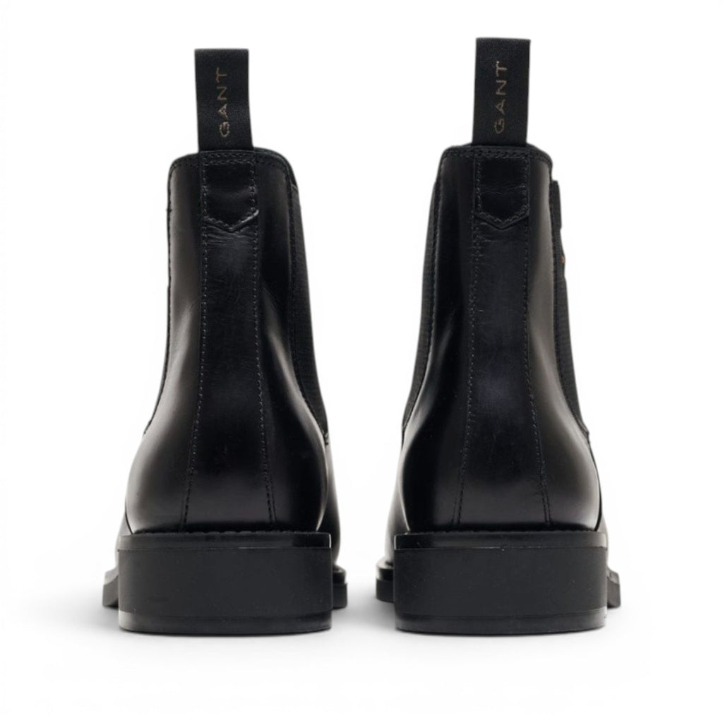 My Store black leather Chelsea boots with elastic side panels and GANT logo pull tab.