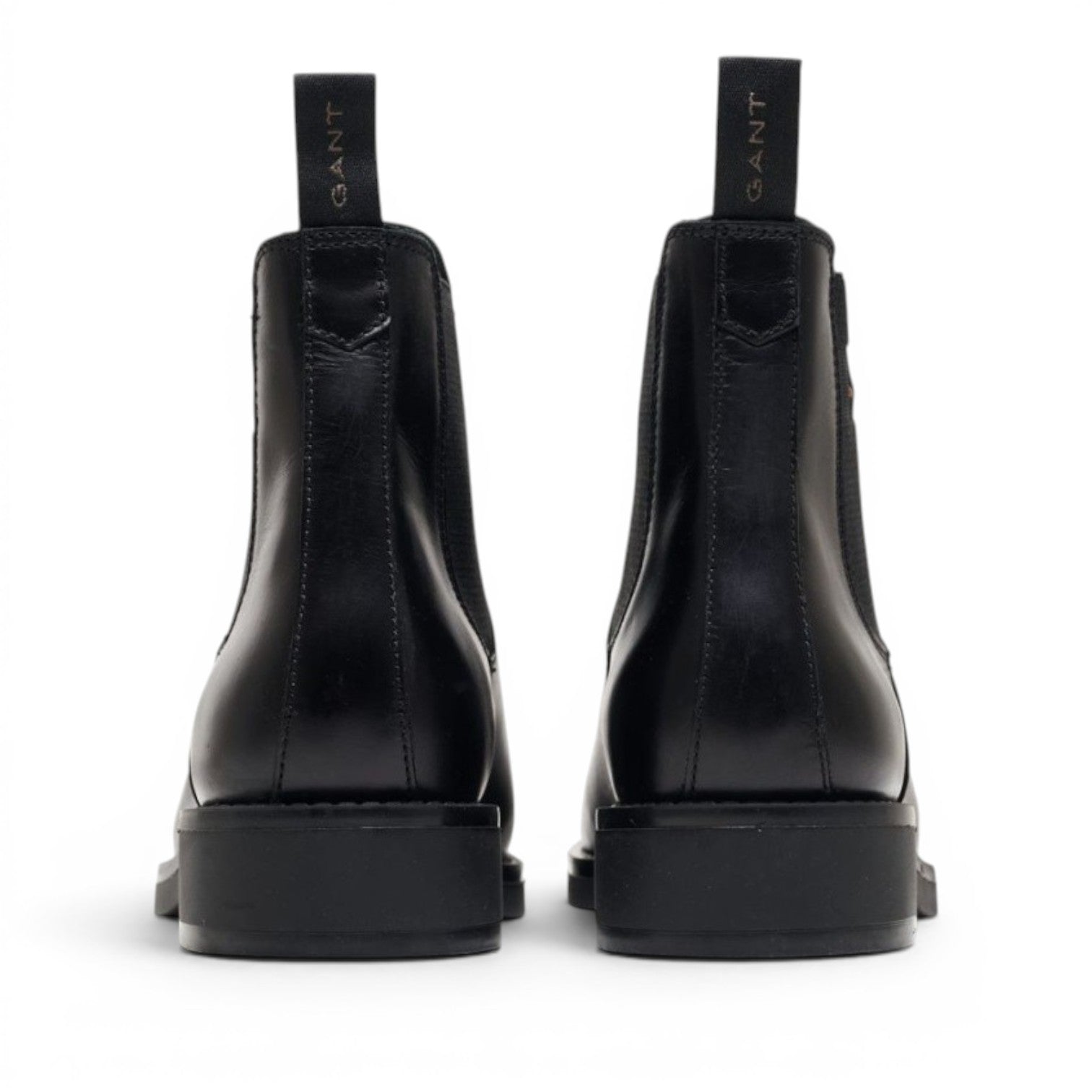 My Store black leather Chelsea boots with elastic side panels and GANT logo pull tab.
