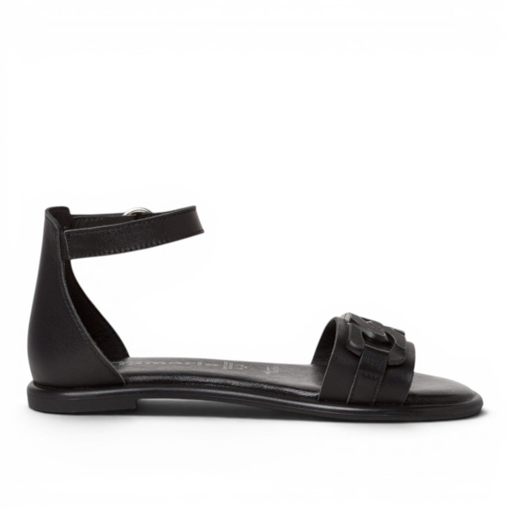 My Store black leather flat sandals with ankle strap and decorative front detail.