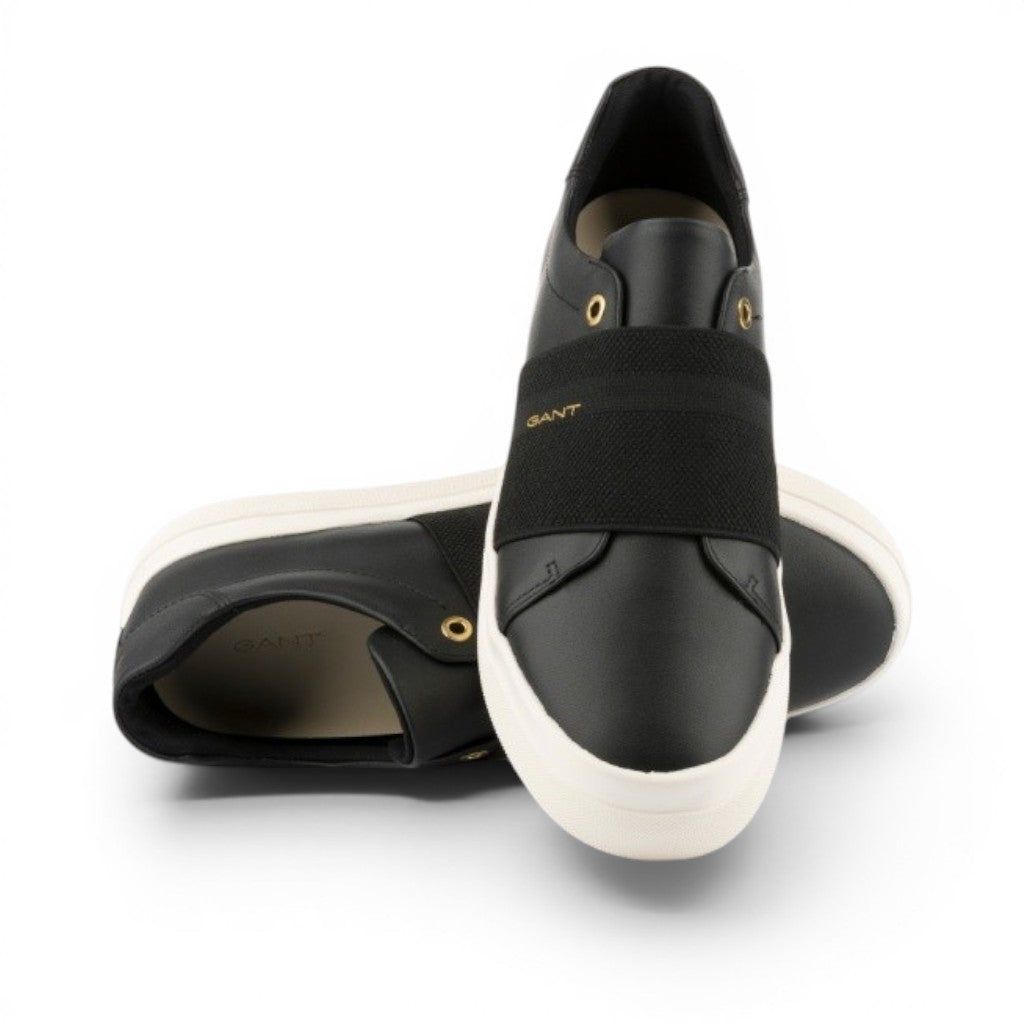 My Store black leather slip-on sneakers with elastic strap and white sole. GANT logo detail.