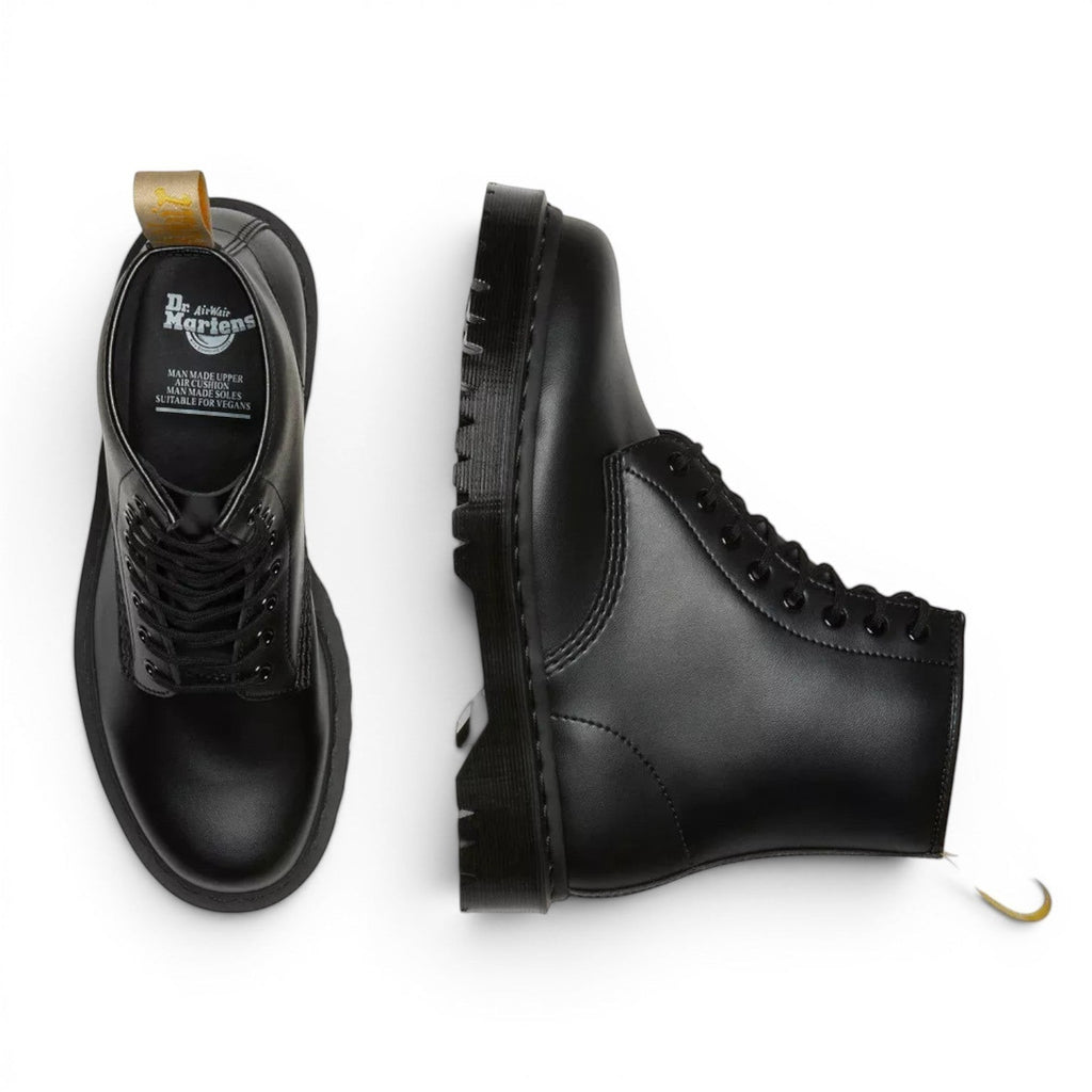 My Store black vegan leather 1460 Bex Mono Dr. Martens boots with yellow heel loop and thick sole.