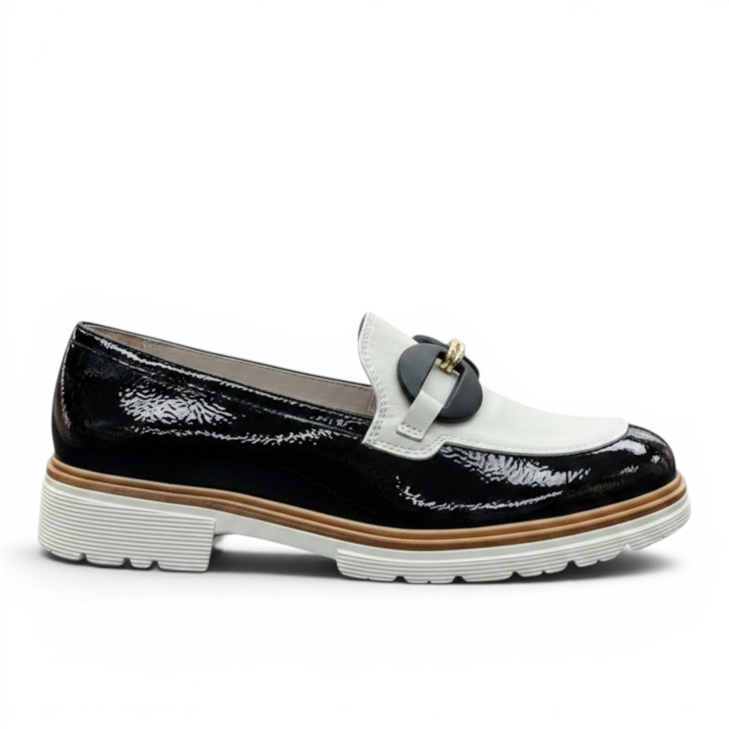My Store black and white patent leather loafers with a decorative buckle and leather lining.