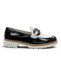 My Store black and white patent leather loafers with a decorative buckle and leather lining.