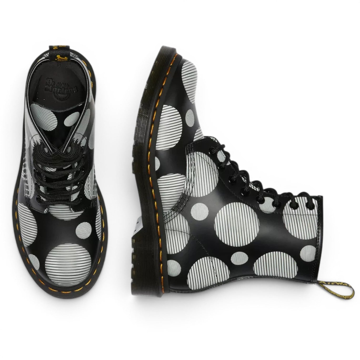 My Store Dr. Martens 1460 Polka Dot Smooth Leather boots in black with white circles and stripes pattern. Lace-up ankle boots made of 100% leather.