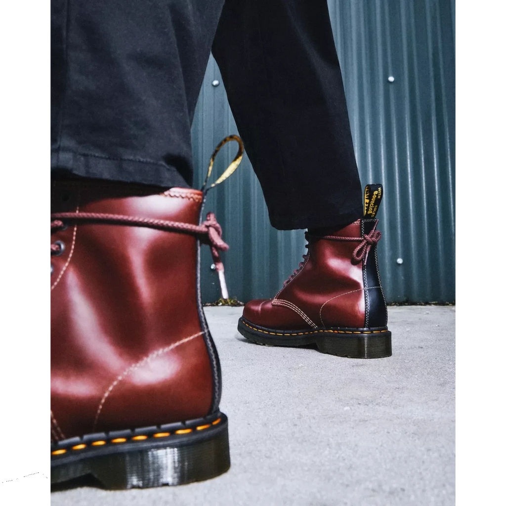 My Store Dr. Martens 1460 Abruzzo Leather burgundy boots with yellow stitching and black heel detail.