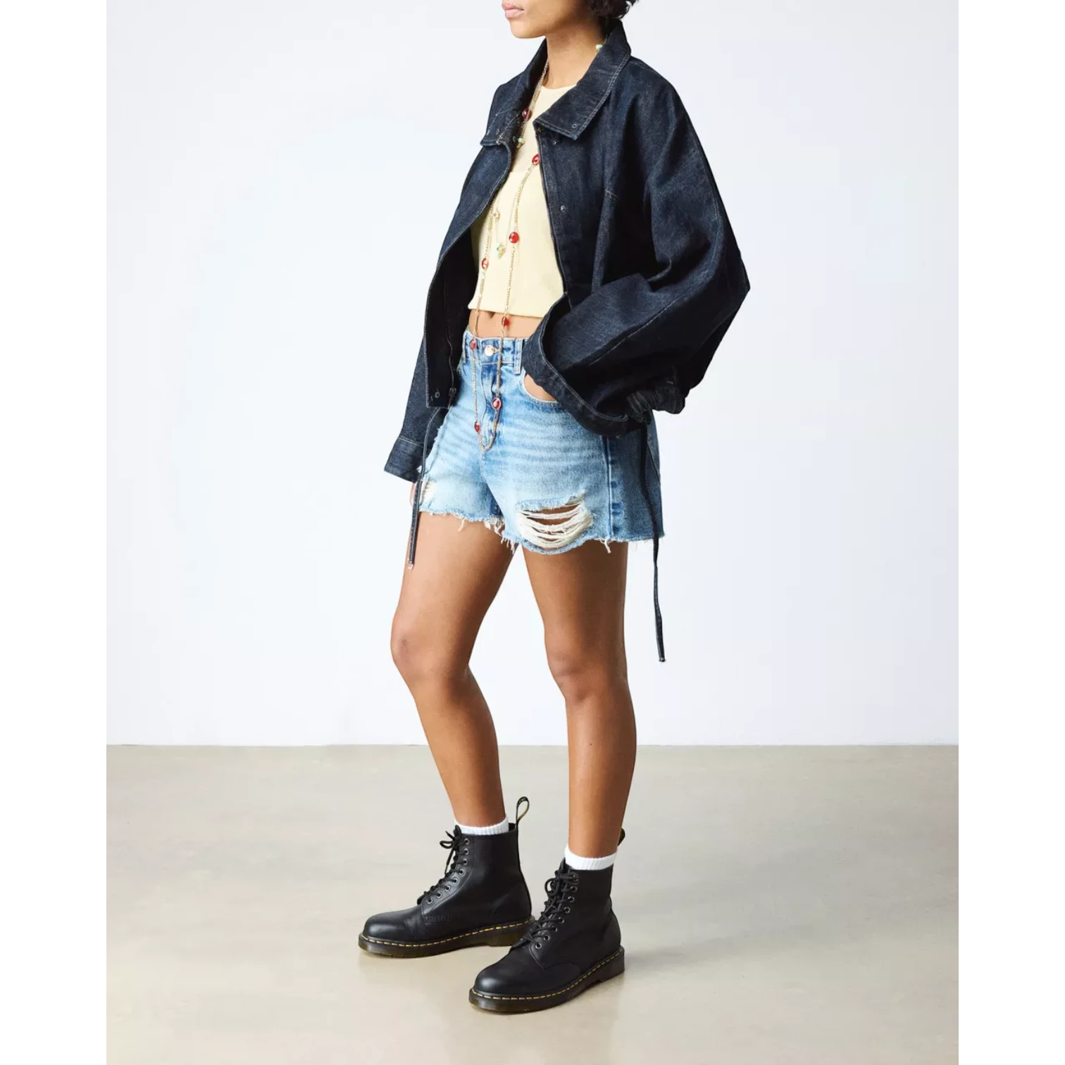 My Store Dr. Martens 1460 Nappa Leather black lace-up boots with yellow stitching on the sole.