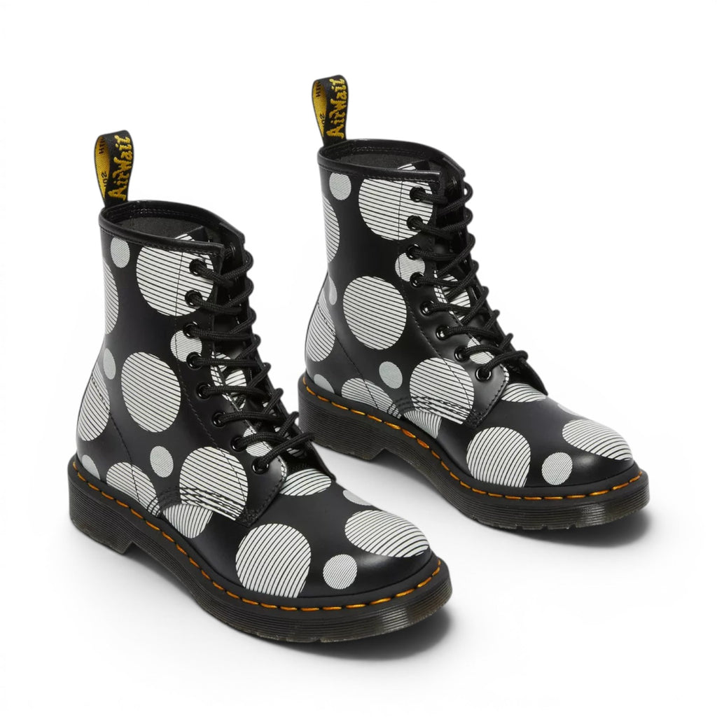 My Store Dr. Martens 1460 black smooth leather boots with white polka dot and stripe pattern. Lace-up front, yellow stitching.