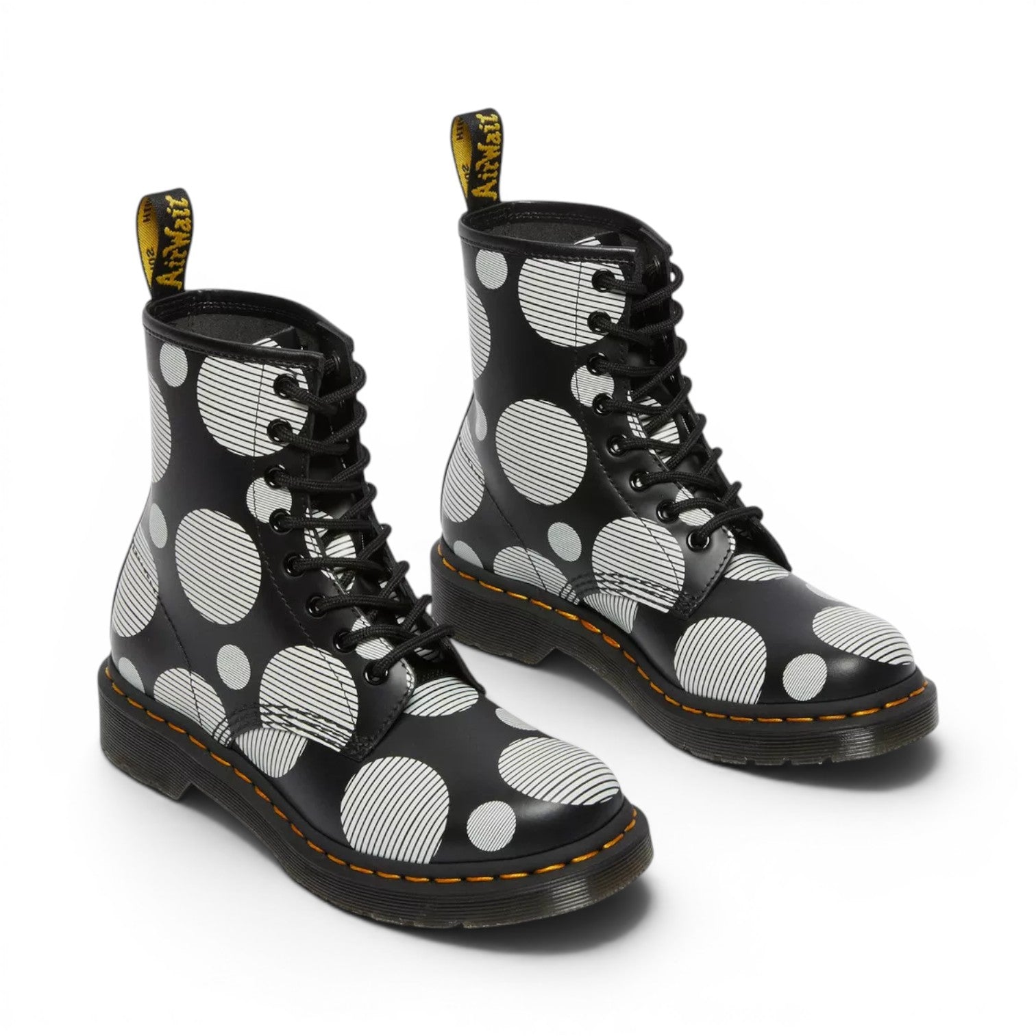 My Store Dr. Martens 1460 black smooth leather boots with white polka dot and stripe pattern. Lace-up front, yellow stitching.