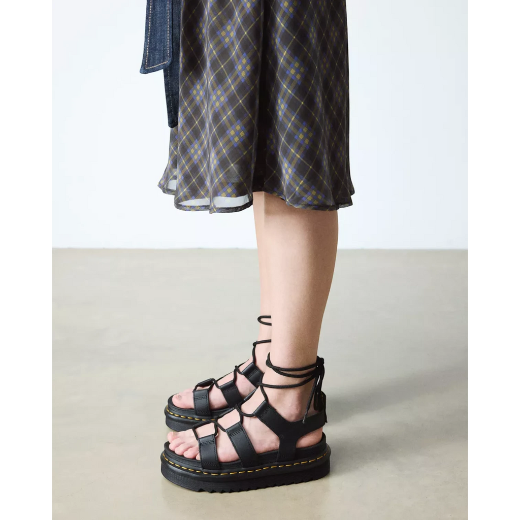 My Store Dr. Martens black hydro leather lace-up gladiator sandals with platform sole and ankle ties.