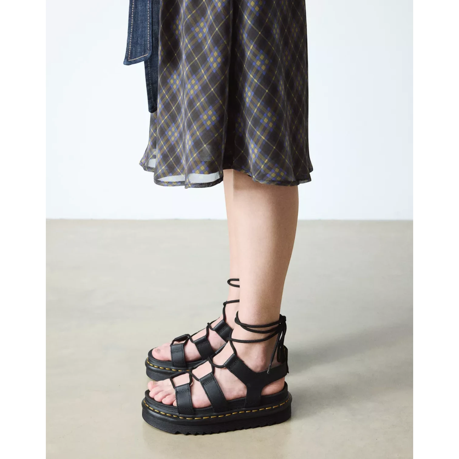 My Store Dr. Martens black hydro leather lace-up gladiator sandals with platform sole and ankle ties.