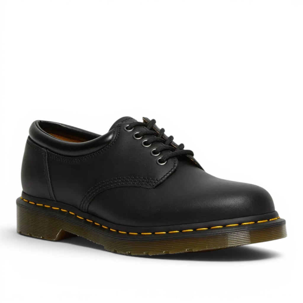 My Store Dr. Martens 8053 Nappa Leather black low-top shoes with yellow stitching and lace-up closure.
