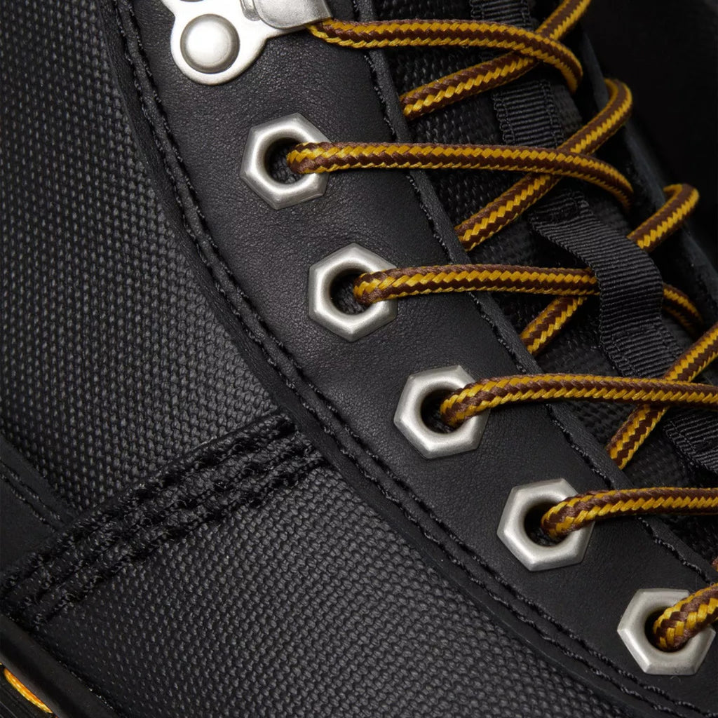My Store Dr. Martens black faux fur-lined leather and textile boots with yellow and brown laces and silver eyelets.