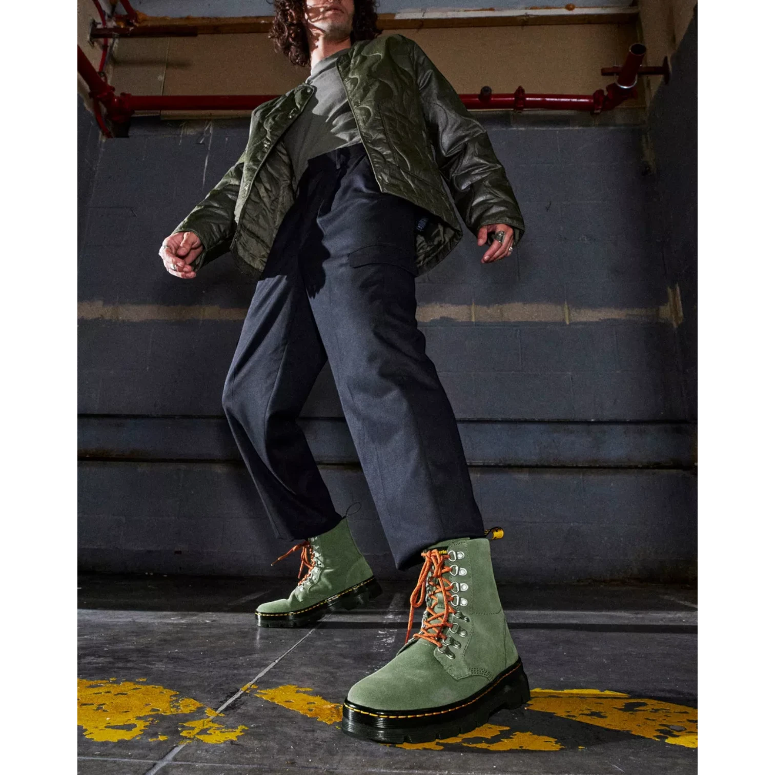My Store Dr. Martens green suede utility boots with orange laces and black platform sole.
