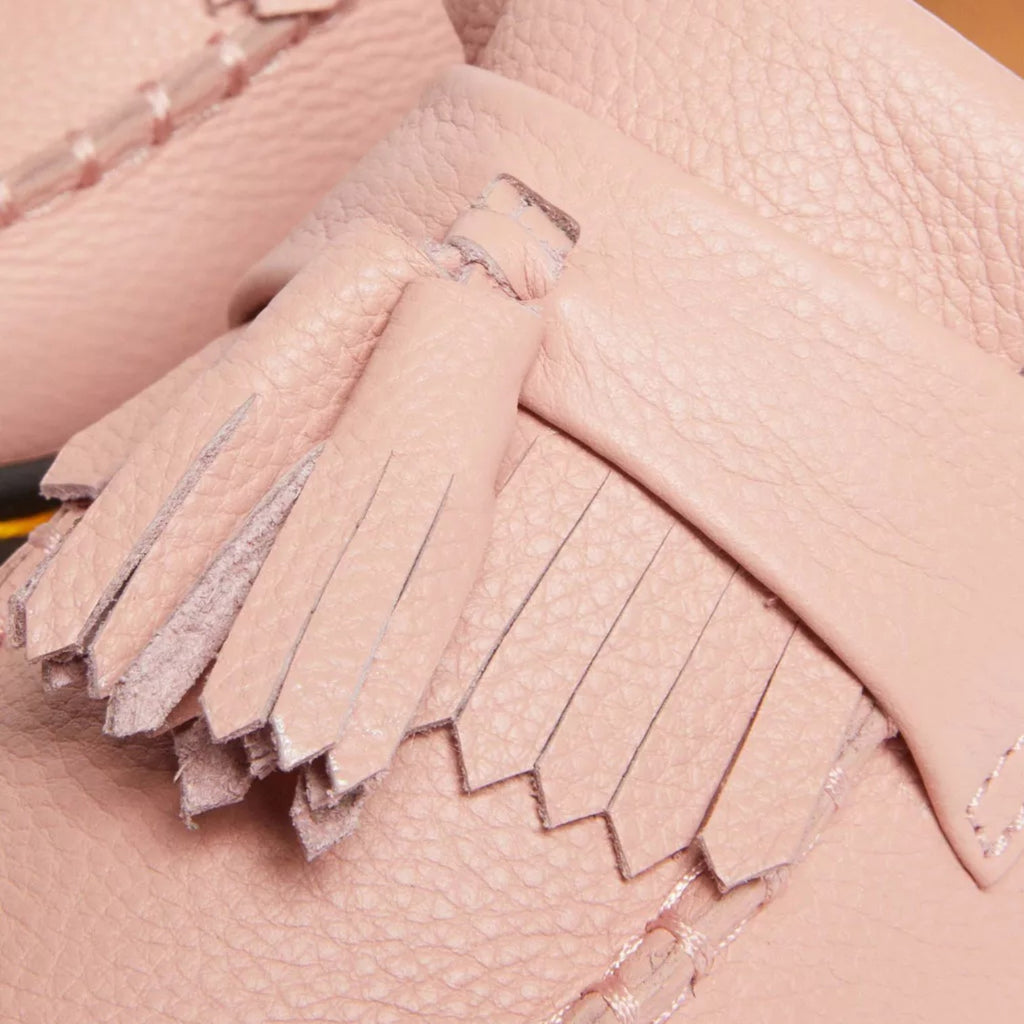 My Store Dr. Martens Adrian Virginia leather tassel loafers in pale pink. Soft, flexible leather with a textured finish and decorative fringe.