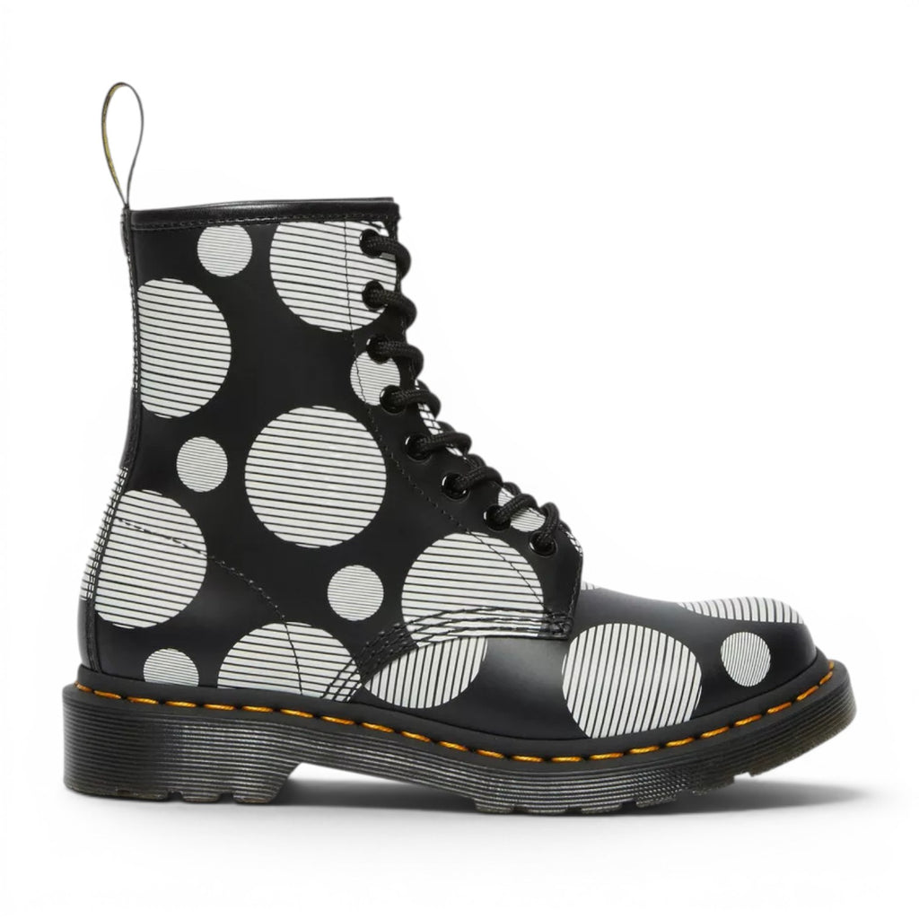 My Store Dr. Martens 1460 black leather boots with white polka dot and stripe pattern. Features yellow stitching and black laces.