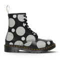 My Store Dr. Martens 1460 black leather boots with white polka dot and stripe pattern. Features yellow stitching and black laces.