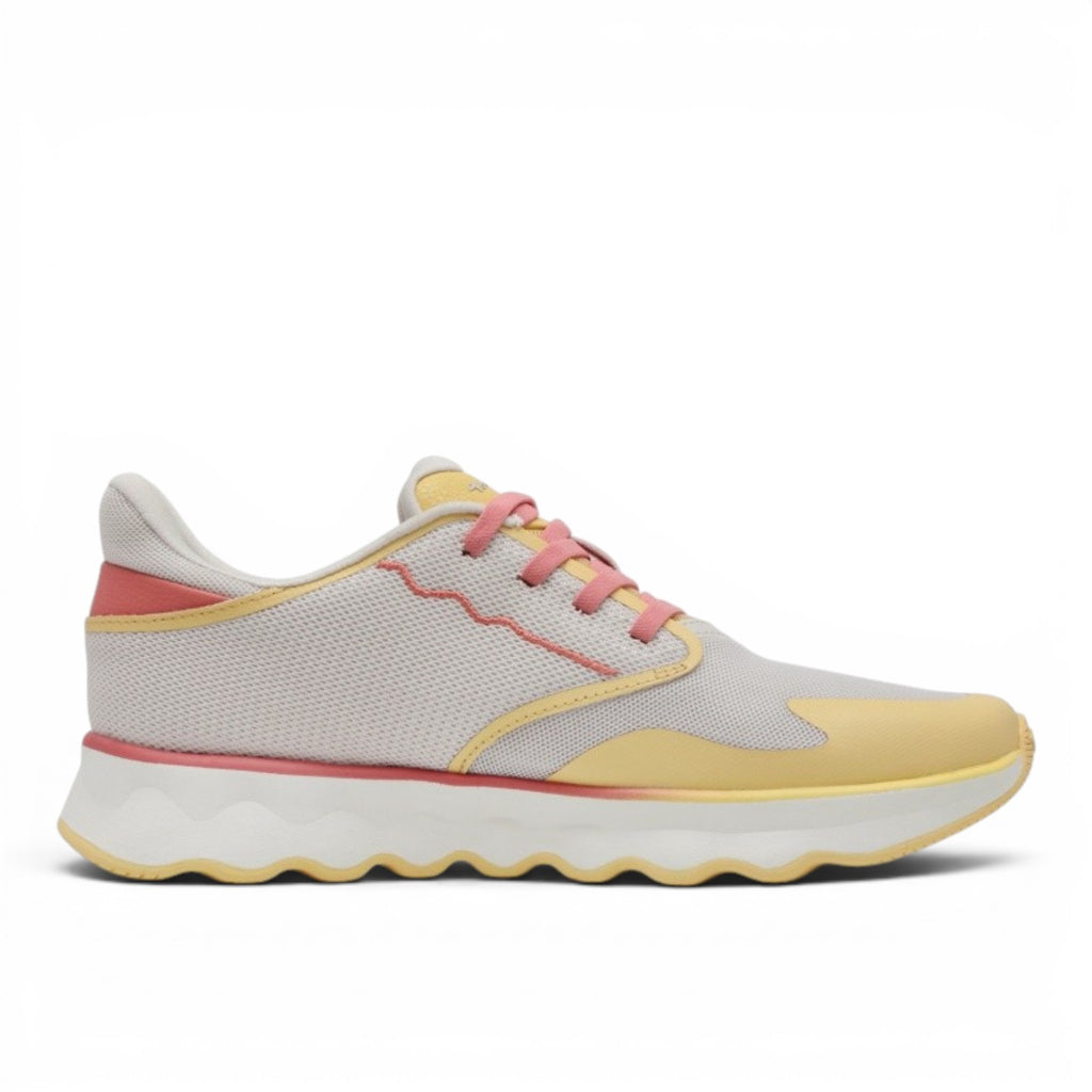 My Store Tamaris light grey mesh sneakers with yellow and coral accents and pink laces. Features a thick, patterned sole.