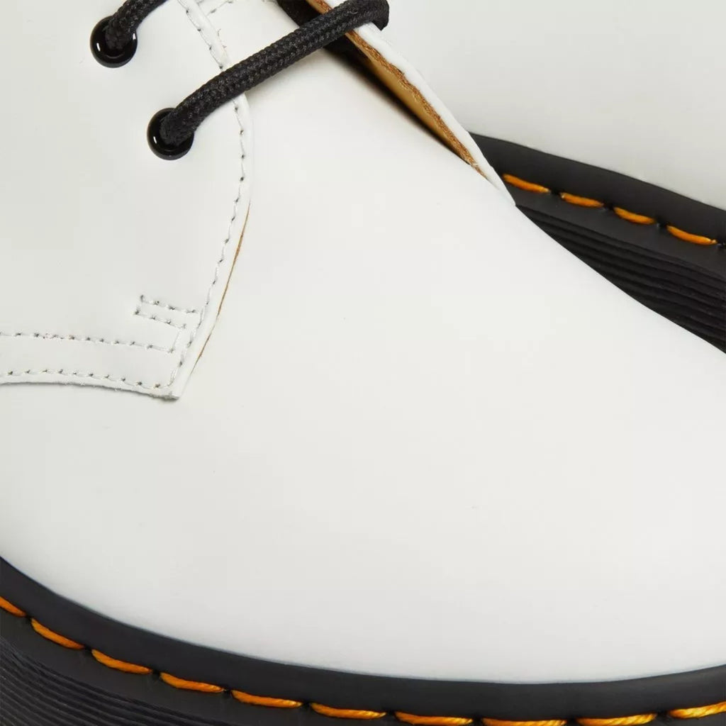 My Store white smooth leather Dr. Martens 1461 Bex Oxford shoes with black laces and yellow stitching on a black PVC sole.