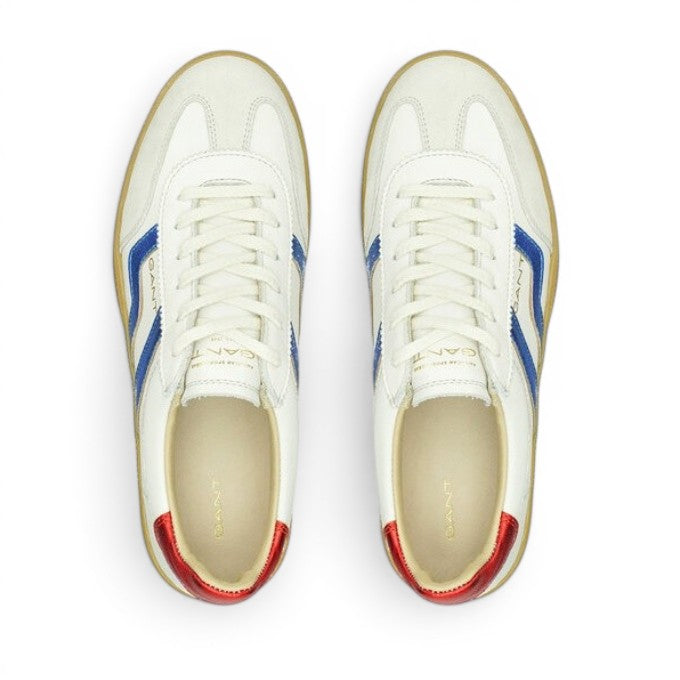 My Store white leather sneakers with blue stripes and red heel accents.