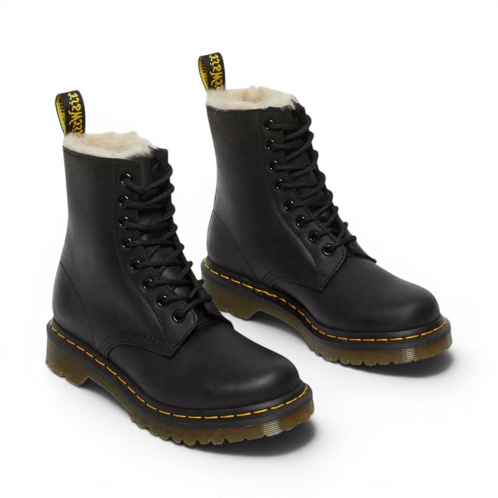 My Store black leather Dr. Martens 1460 Serena boots with faux fur lining and yellow stitching.