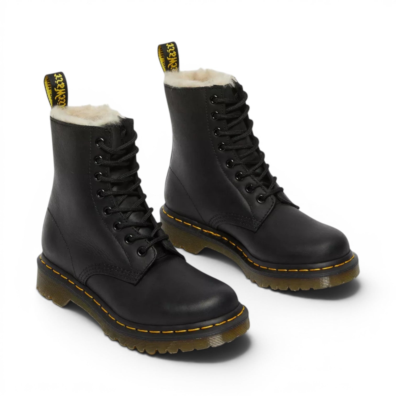 My Store black leather Dr. Martens 1460 Serena boots with faux fur lining and yellow stitching.