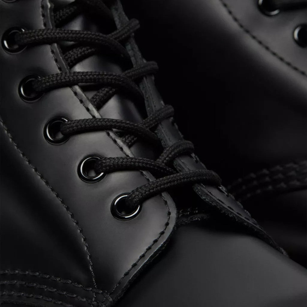 My Store black smooth leather Dr. Martens 1460 lace-up boots with signature stitching.