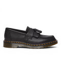 My Store black pebbled leather Dr. Martens Adrian tassel loafers with Goodyear welt construction.