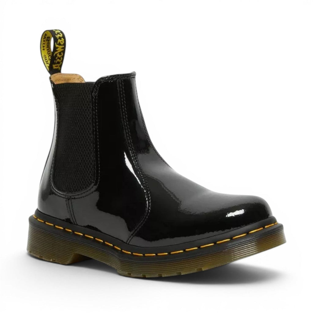My Store Dr. Martens 2976 black patent leather Chelsea boots with yellow stitching and elastic side panels.