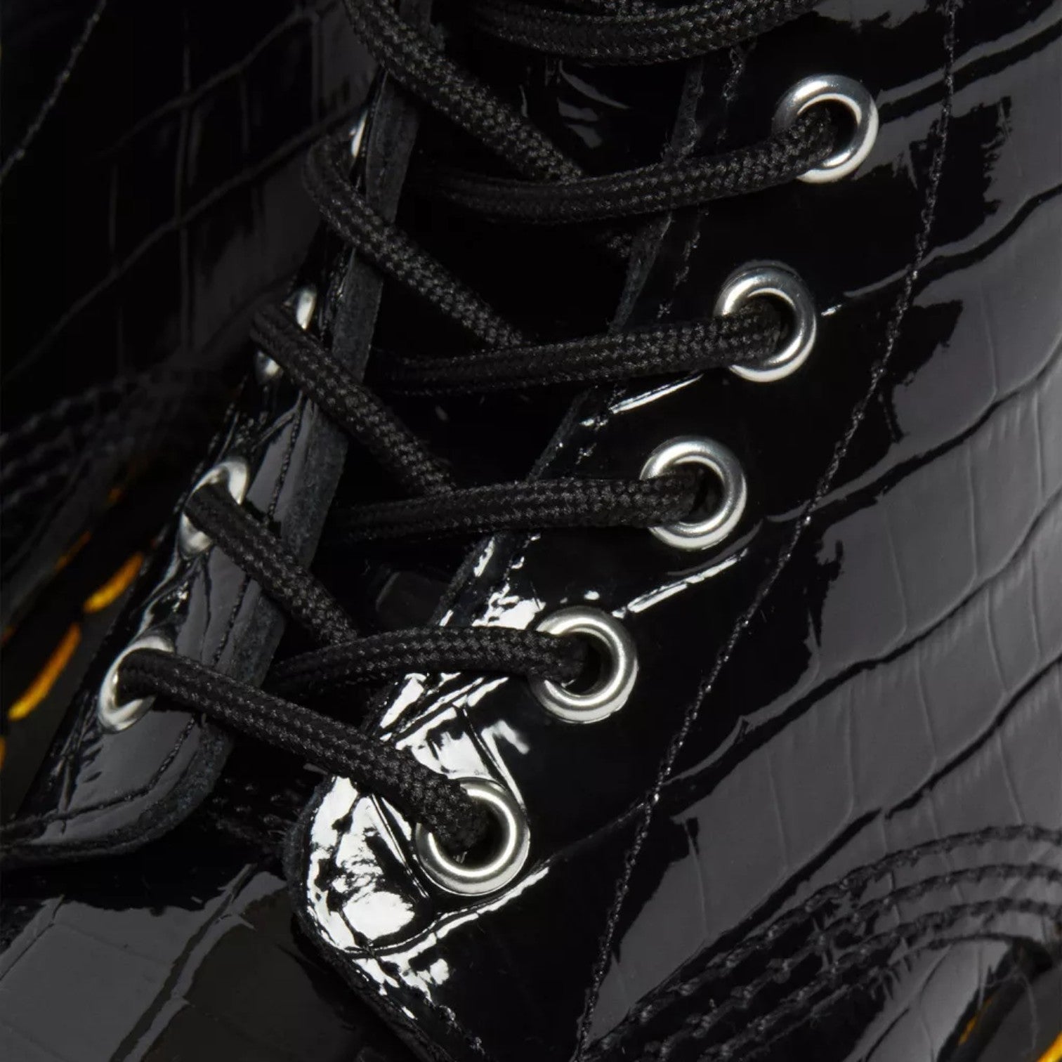 My Store Dr. Martens 1460 Patent Croc Emboss black patent leather lace-up boots with silver eyelets.