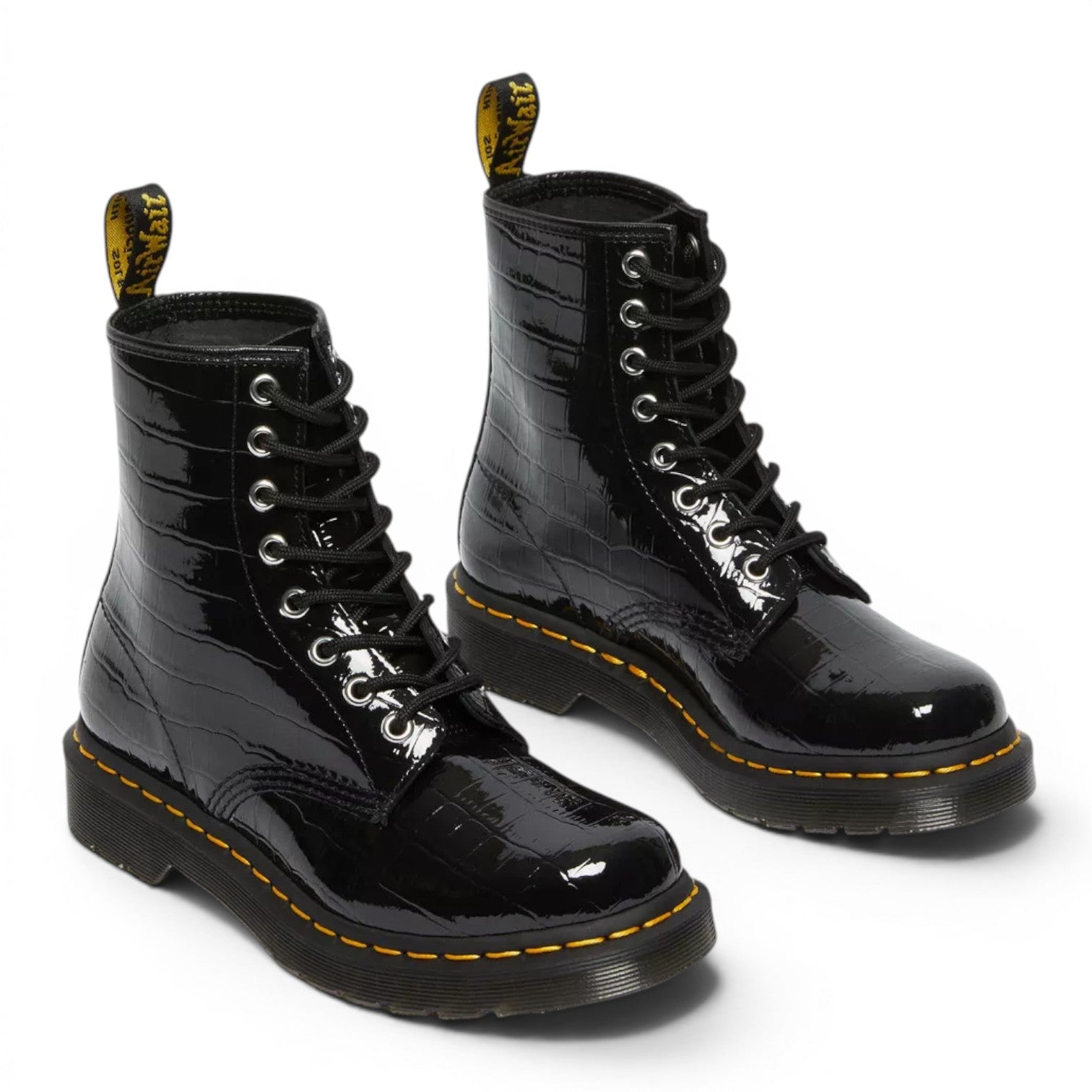 My Store Dr. Martens 1460 Patent Croc Emboss black patent leather boots with croc texture and yellow stitching.