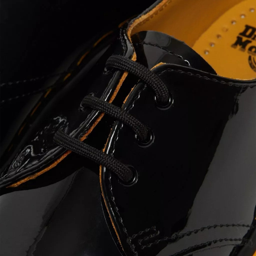 My Store black patent leather 1461 Oxford shoes with yellow stitching and black laces.