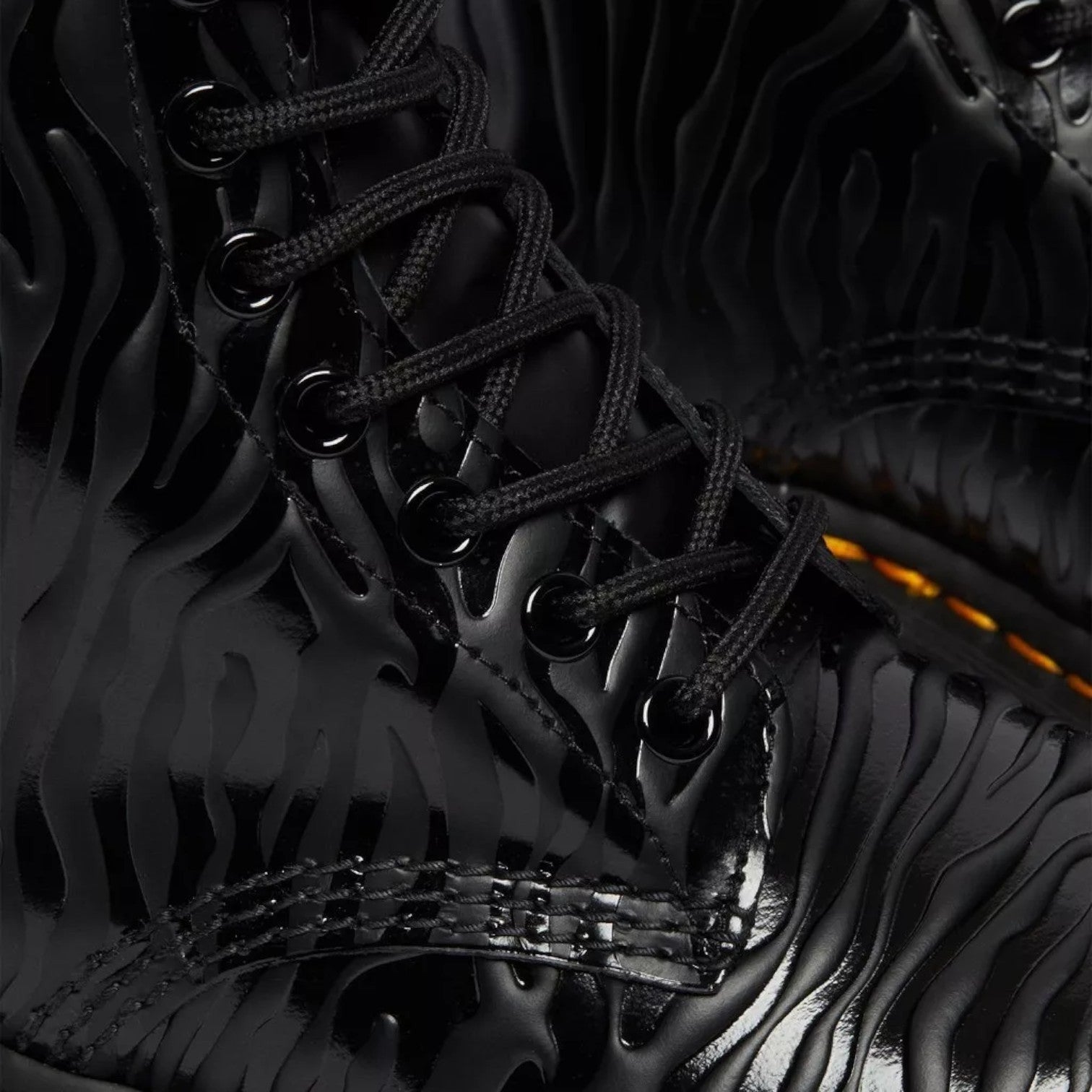 My Store black leather Dr. Martens 1460 Pascal boots with embossed zebra pattern and black laces.