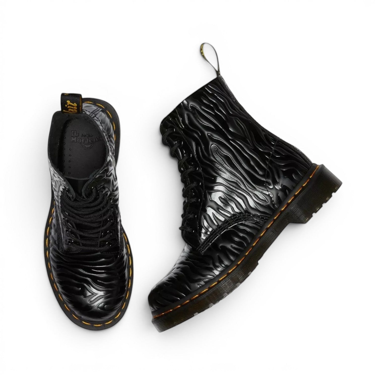 My Store black leather Dr. Martens 1460 Pascal boots with zebra embossed pattern and yellow stitching.
