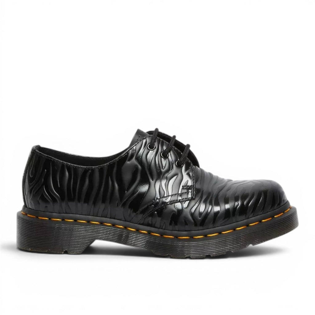 My Store black leather 1461 Zebra Emboss Smooth shoes with embossed zebra pattern and yellow stitching.