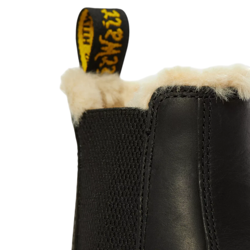 My Store Dr. Martens 2976 Leonore black faux fur lined leather Chelsea boots with yellow heel tab.