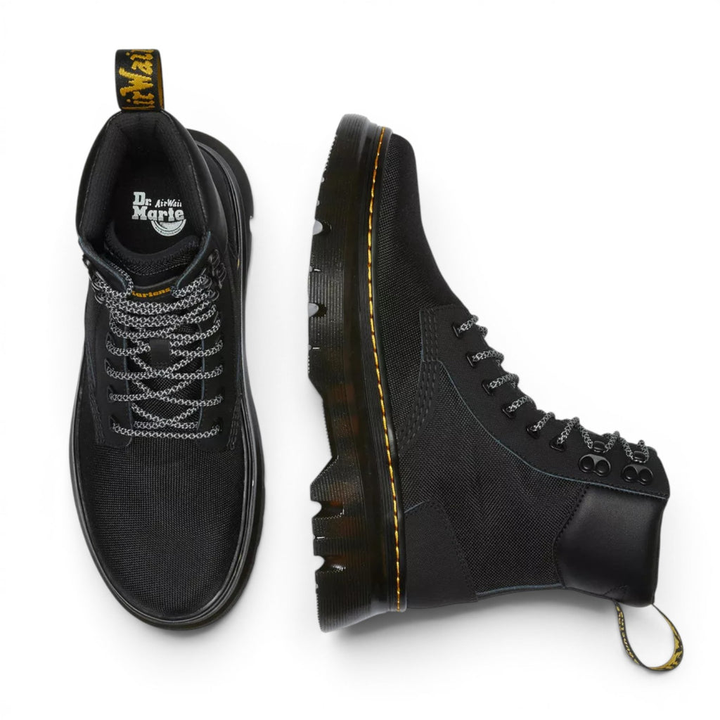 My Store Dr. Martens Tarik Utility boot in black Ajax + Extra Tough 50/50 leather and recycled synthetic textile with black laces and yellow heel loop.