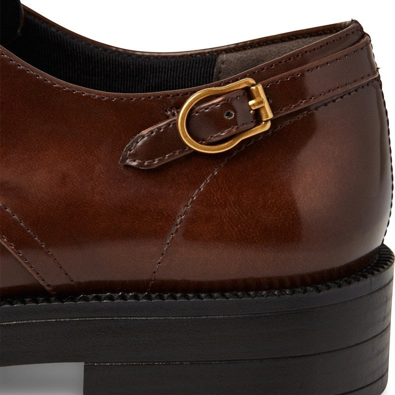 My Store Tamaris brown synthetic leather mary jane shoes with gold buckle and lug sole.