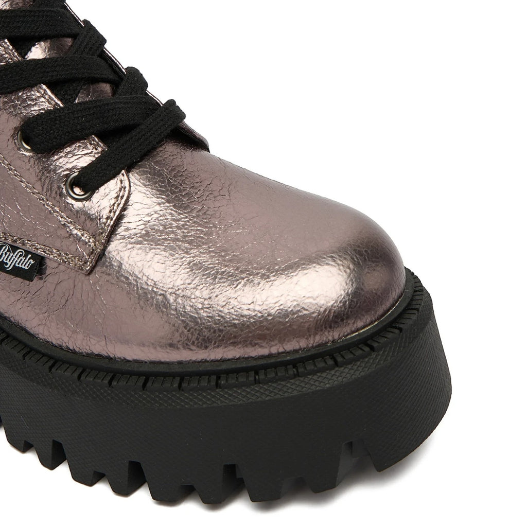 Buffalo Aspen Lace Up Mid boots in rose gold metallic leather with black laces and a thick black lug sole.